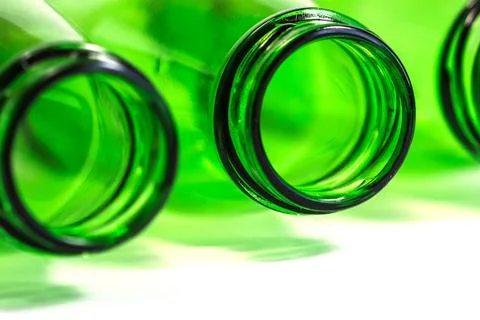 Extra Closeup of Green Bottles on White Background with focus on center Bottle Stock Photos
