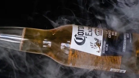 Extra Corona beer bottle spinning and rotate with smoke Stock Footage 126246884