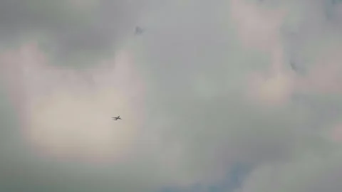 Extra large shot of bottom up seen plane in the cloudy sky. Video stock 296387951