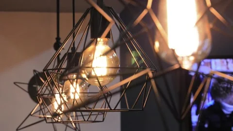 Extra long decorative bulbs in a metal shade. Stock-Footage 122626957