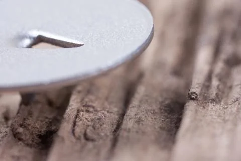 Extra macro image hat metal pushpin on old wood Stock Photos