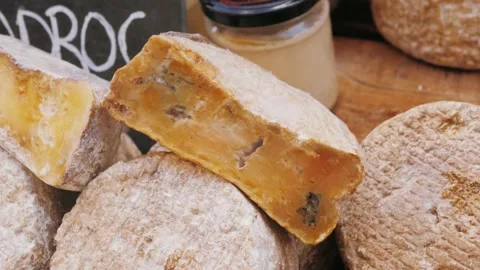 Extra mature old cheese, hard organic cheese with mold. Medieval festival. Stock Footage 194442014