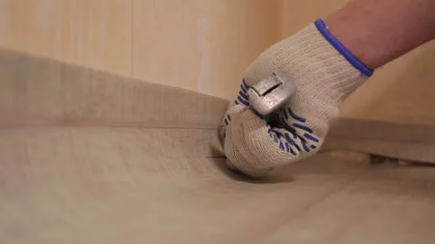 An extra piece of linoleum is being cut with a coulter Stock Footage 95527915