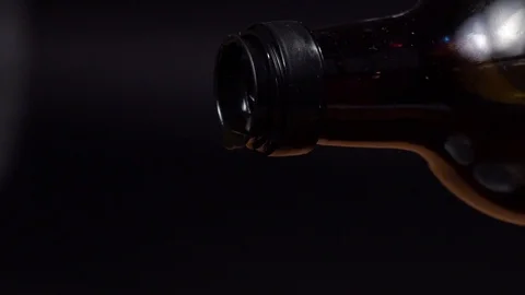 Extra virgin olive oil pouring from bottle to spoon closeup Slow Motion Pouring 스톡 동영상 101812047