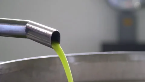 Extra Virgin Olive Oil Production, Olive oil comes out of the mill tap Stock Footage 287828150