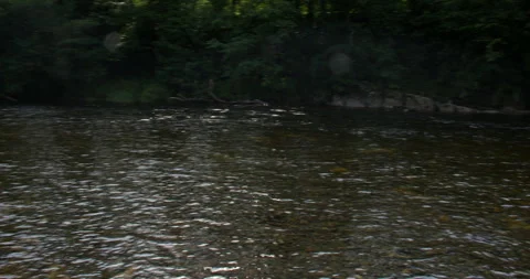 Extra wide panning shot left to right of the river Lune next to the Devils Stock Footage 328932039