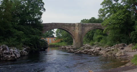 Extra Wide Shot of the Devils bridge from the river Lune with Stanley bridge in Stock Footage 328891413
