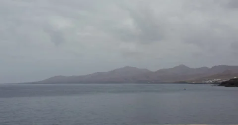 Extra wide shot looking West up the coast at Puerto del Carmen. From the Old 動画素材 336724091