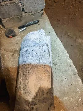 Extracted concrete core sample showing internal structure of reinforced con.. Stock Photos