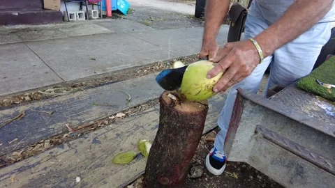 Extracting coconut water in slow motion. Stock Footage 223962021