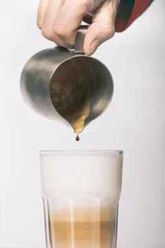 Extracting coffee and making several hot drinks in studio Stock Photos