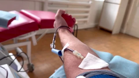 Extraction of blood from a vein using a needle Stock Footage 294971769