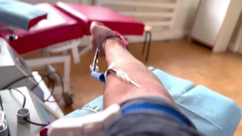 Extraction of blood from a vein using a needle Stock Footage 294971833