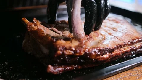 Extraction of bones from pig ribs. Stock Footage 167706667