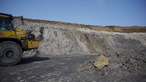Extraction of coal in a quarry by an excavator Stock Footage 81263285