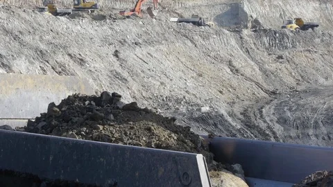 Extraction of coal in a quarry by an excavator Stock Footage 81263288