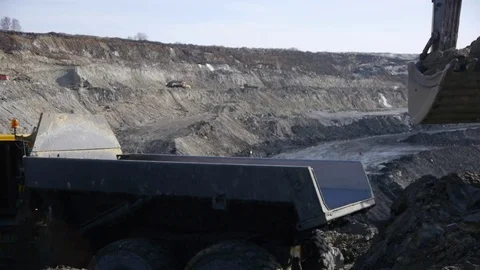 Extraction of coal in a quarry by an excavator Stock Footage 81263306