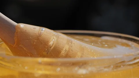 Extraction honey with a dipper Stock Footage 99420101