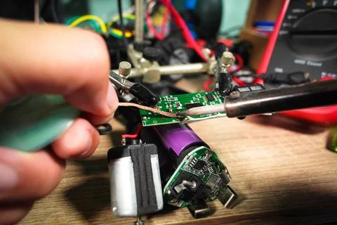 The extraction of lead using desoldering wire or solder wick and soldering lead Stock Photos