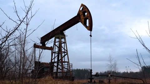 Extraction of oil from the subsoil with a small pump Stock Footage 249526415