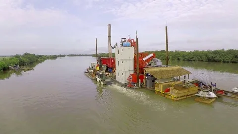 An extraction platform navigates in a river. Africa, Mali. About industry Stock Footage 71345527