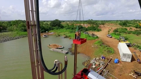 An extraction platform. Two people on a platform suspended from a crane Stock Footage 71353433
