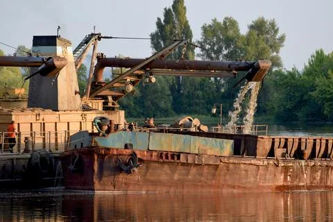 Extraction of sand from the river bottom by dredger. Stock Photos