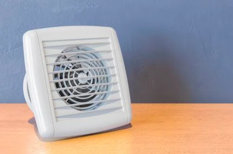 Extractor Fan for bathroom or kitchen on the wooden table. 3D rendering Stock Illustration