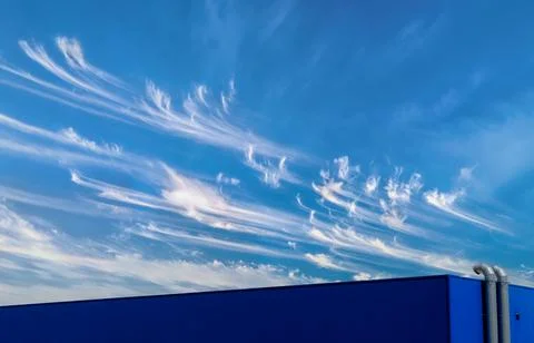 Extractor pipes in front of a clear sky. Industrial structure. Clean energy. Stock Photos