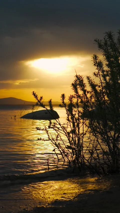 An extraordinarily beautiful sunset with a landscape view of the lake. Stock Footage 336620910