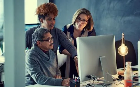 Extraordinary ideas develop naturally when they work as a team. a group of Stock Photos