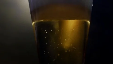 Extream close-up beer in glass. Beer bubbles. Stock Footage