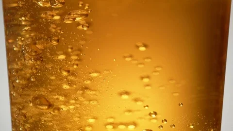 Extream close-up beer in glass. Bubbles rising. Slow Motion. Video stock 72850284