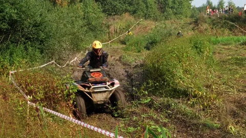 Extreme ATV race through mud Stock Footage 189588386