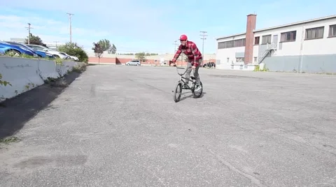 Extreme bmx rider does peg trick Stock Footage 56566127