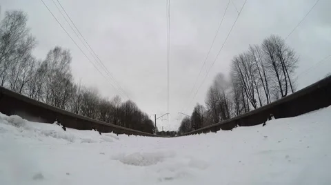Extreme camera is mounted under the train on the rails. Suburban train passes ov Stock Footage 46012979
