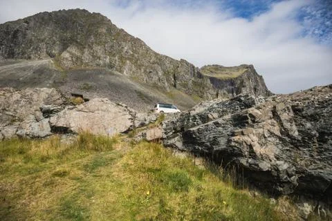 Extreme camping between basalt rocks in a volkswagen california Stock Photos