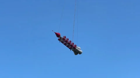 Extreme carousel in amusement park. Rocket flies in blue sky. Stock Footage 312264270