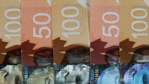 Extreme close up of $100 and $50 Canadian bills. Stock Footage 102413228