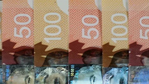 Extreme close up of $100 and $50 Canadian bills. Stock Footage 102413683