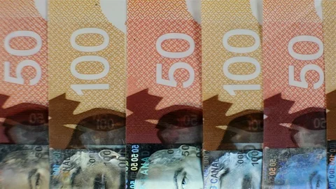 Extreme close up of $100 and $50 Canadian bills. Stock Footage 102414153