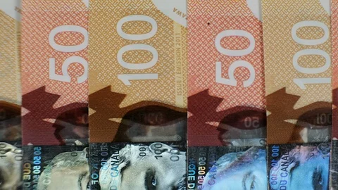 Extreme close up of $100 and $50 Canadian bills. Stock Footage 102414600