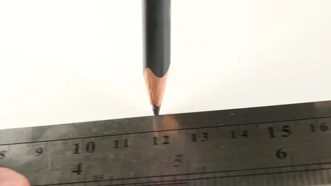 Extreme close-up. 4k, slow motion. pencil draws a line on the ruler Stock Footage 82958306
