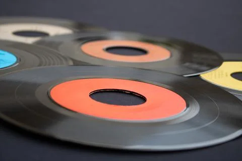 Extreme close-up of 7 inch vinyl records on a dark background Stock Photos