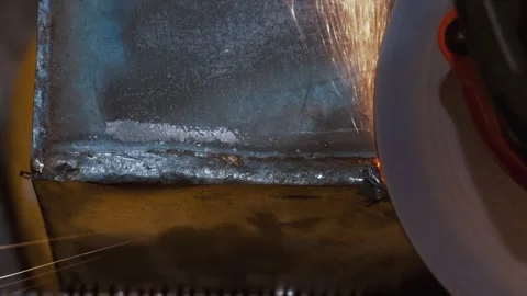Extreme Close Up Of Abrasive Disc Grinding Hard Steel Surface With Sparks Видео 341547822