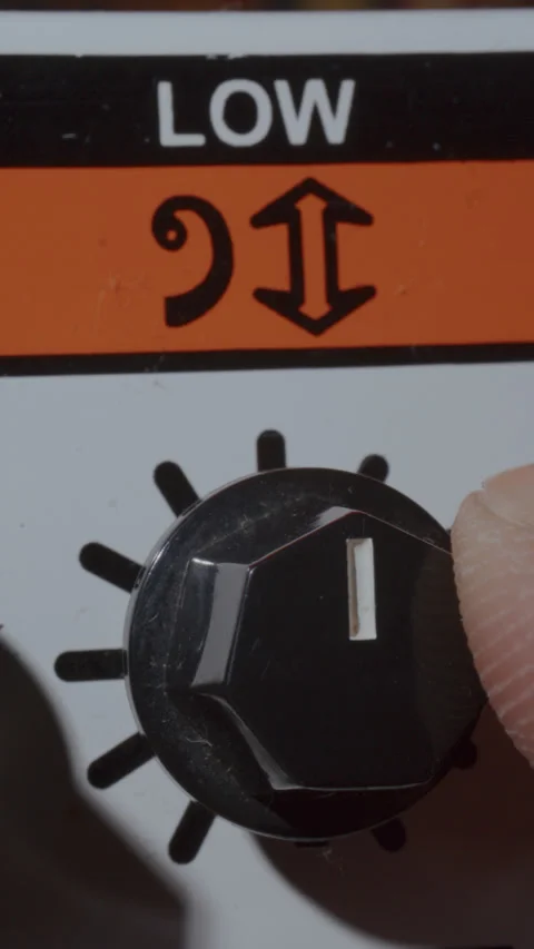 Extreme Close Up of Adjusting Low Frequency Knob on Retro Amplifier 库存影片 342454193