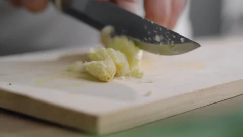Extreme close-up and selective focus of hands cutting young baby corn cobs,.. Stock Footage 329703694