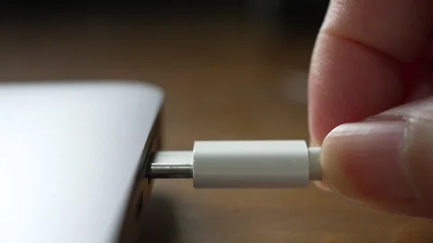 Extreme Close Up and Slow Motion of woman Plug in USB C Cable to Charge Computer Video stock 275630736