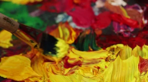 Extreme close-up of an artist brush painting with oil paints. Palette Stock Footage