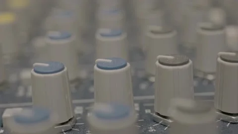 Extreme close up of audio mixer knobs in recording studio 動画素材 233986283